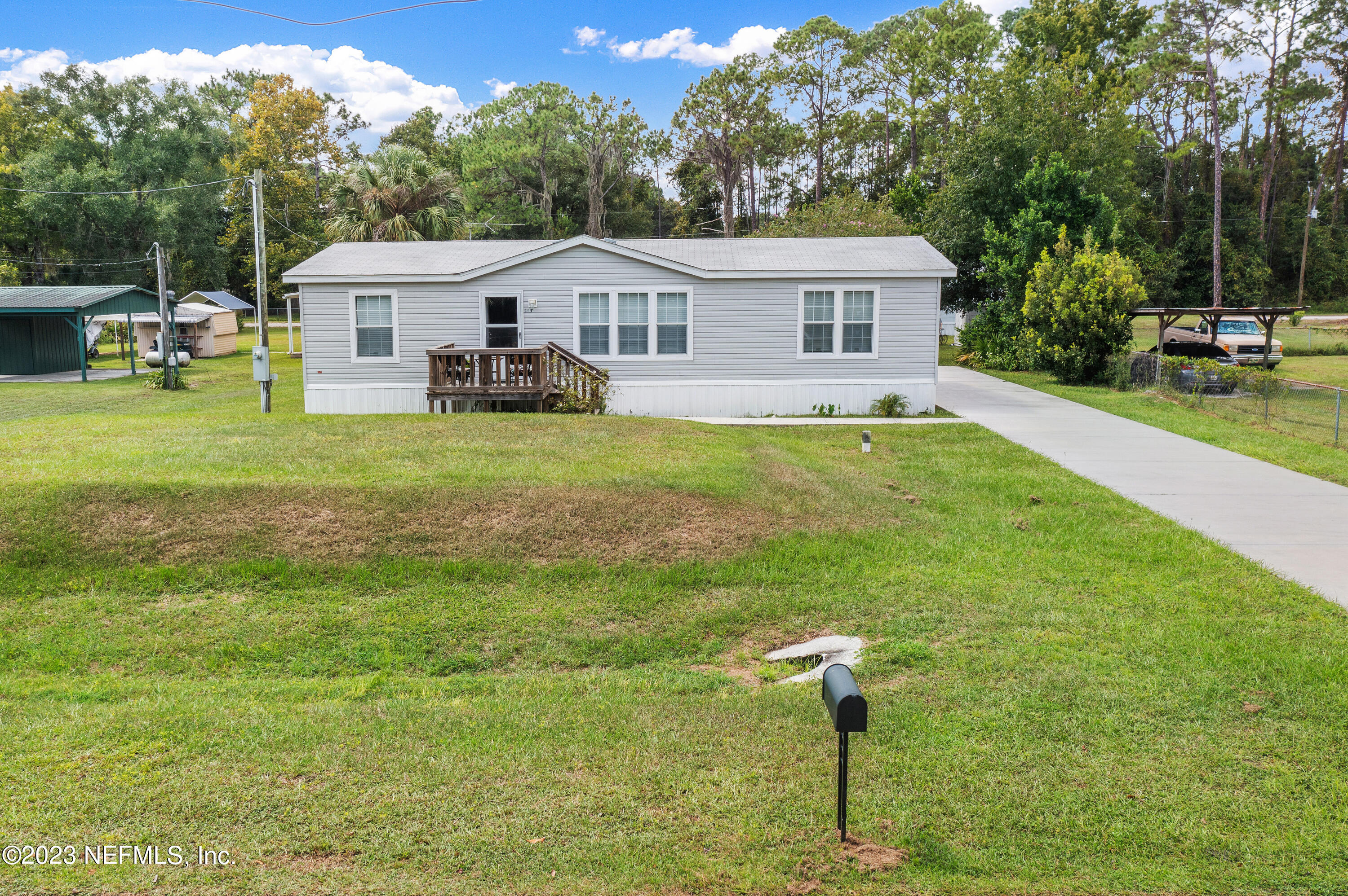 117 Riverside Avenue Satsuma, FL 32189 - Photo 24 of 24 a front view of a house with garden