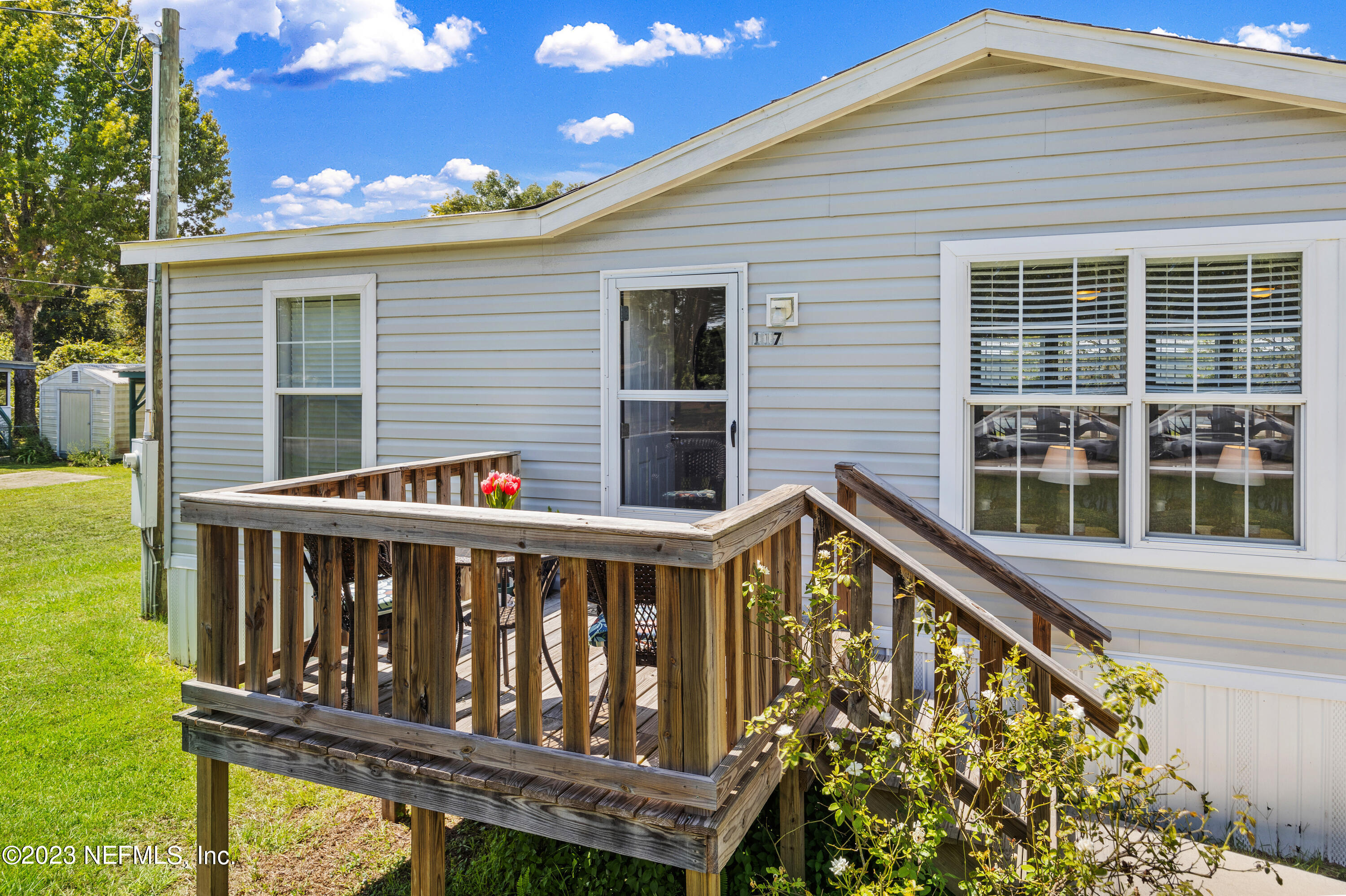 117 Riverside Avenue Satsuma, FL 32189 - Photo 5 of 24 a view of wooden house with a large window