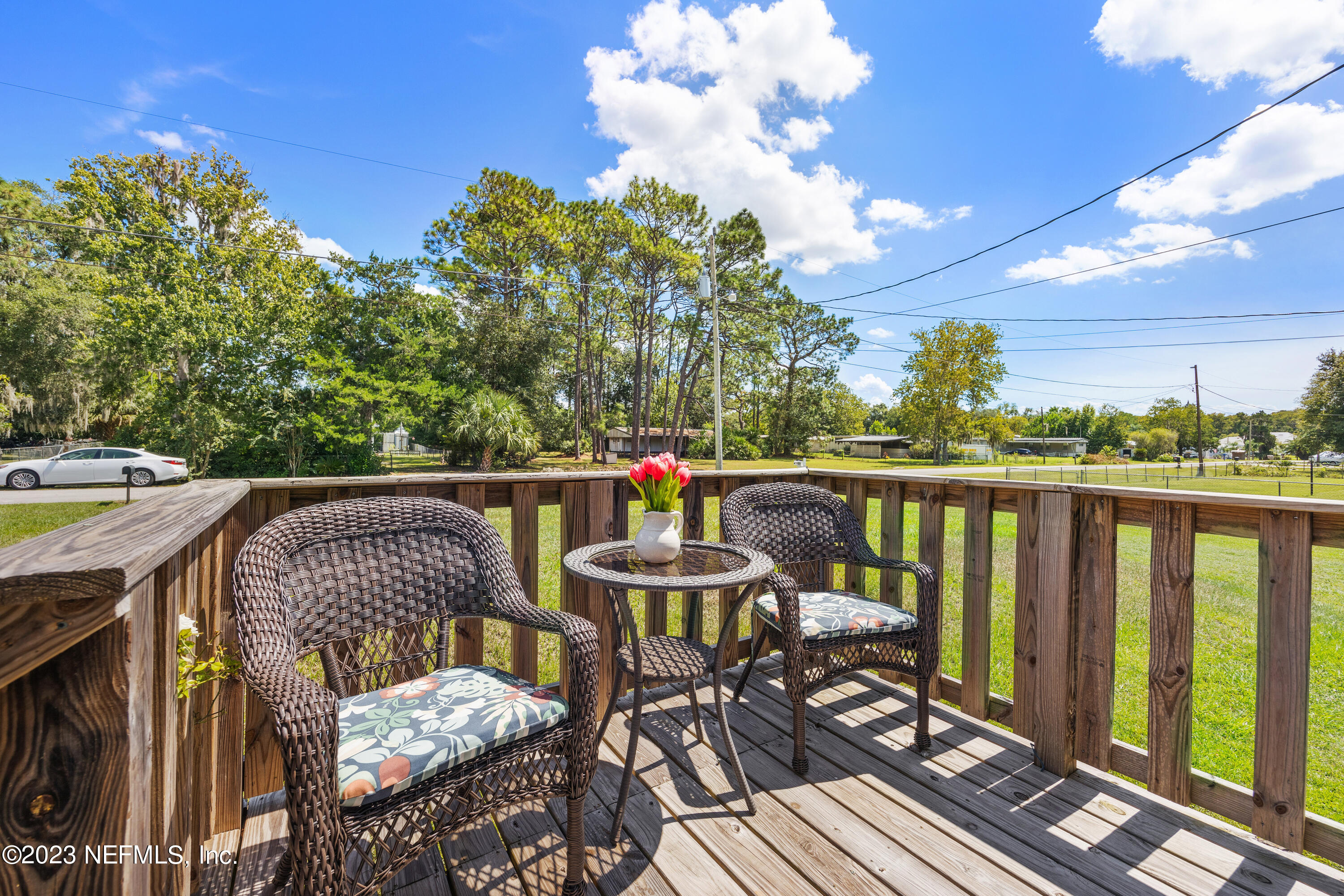 117 Riverside Avenue Satsuma, FL 32189 - Photo 6 of 24 a view of a chairs and table on the deck