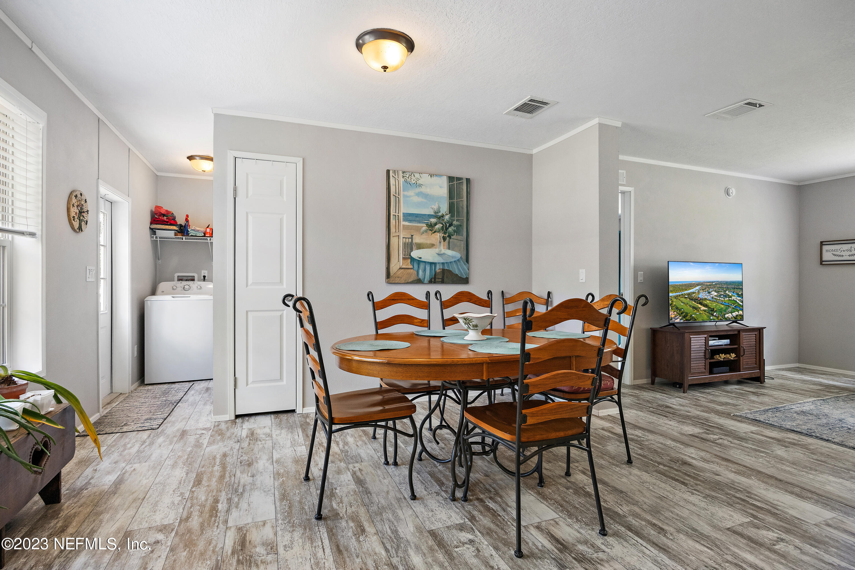 117 Riverside Avenue Satsuma, FL 32189 - Photo 8 of 24 a dining room with furniture and wooden floor