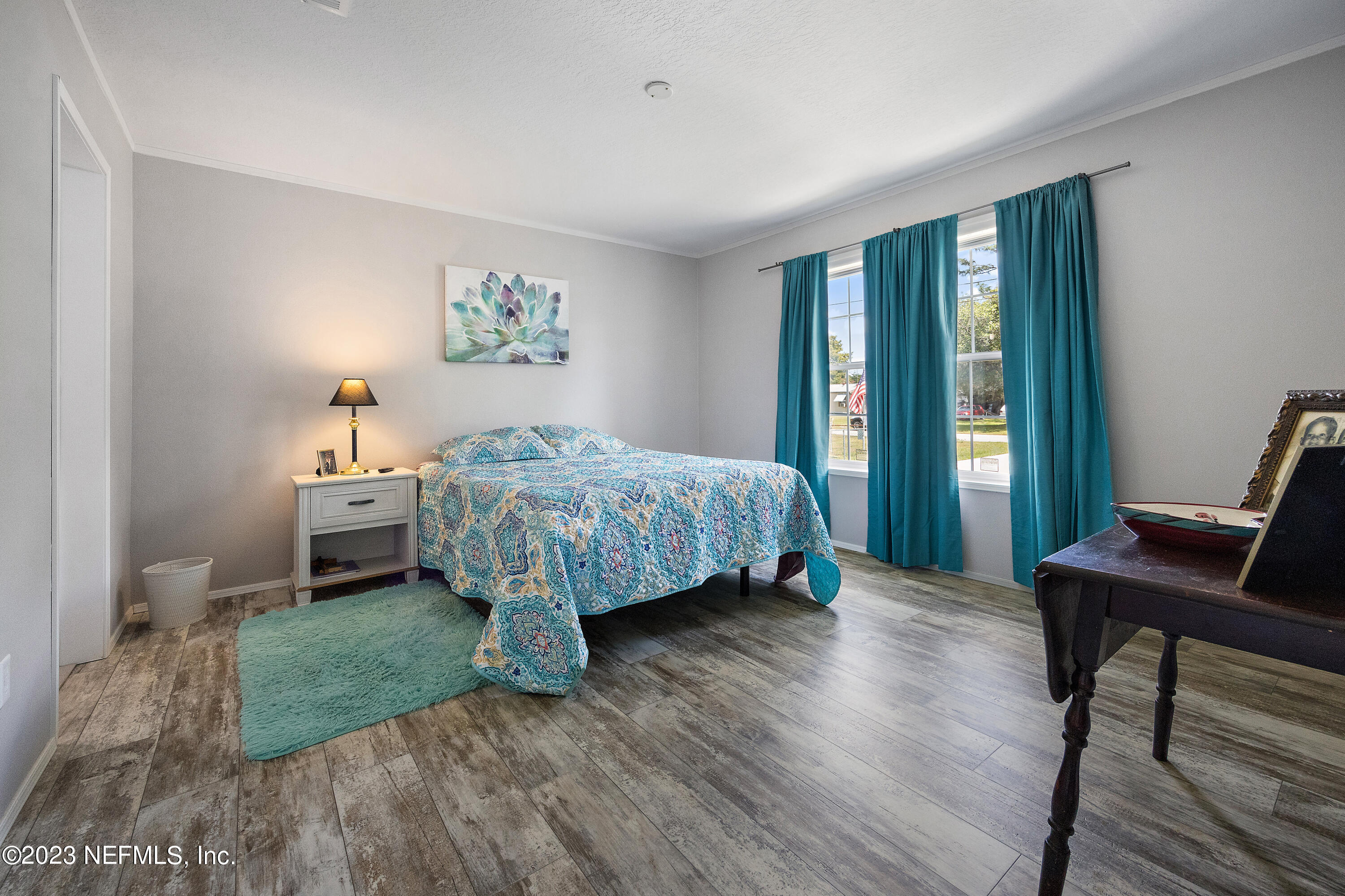 117 Riverside Avenue Satsuma, FL 32189 - Photo 10 of 24 a bedroom with a bed and a window