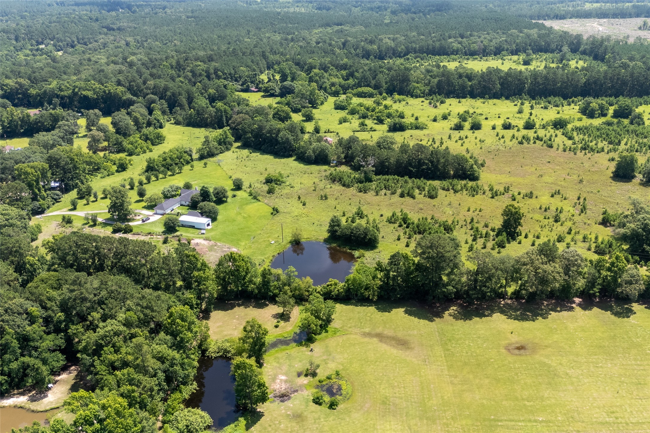 0 R L R L Moffett Street Goodrich, TX 77335 - Photo 15 of 17 a view of a lake with a house