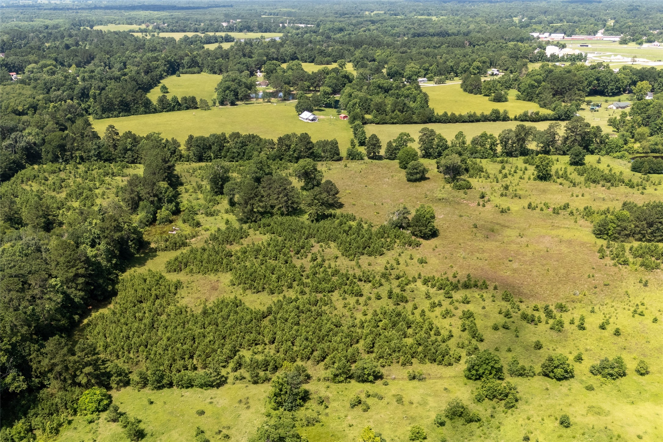 0 R L R L Moffett Street Goodrich, TX 77335 - Photo 8 of 17 an aerial view of residential houses with outdoor space and trees