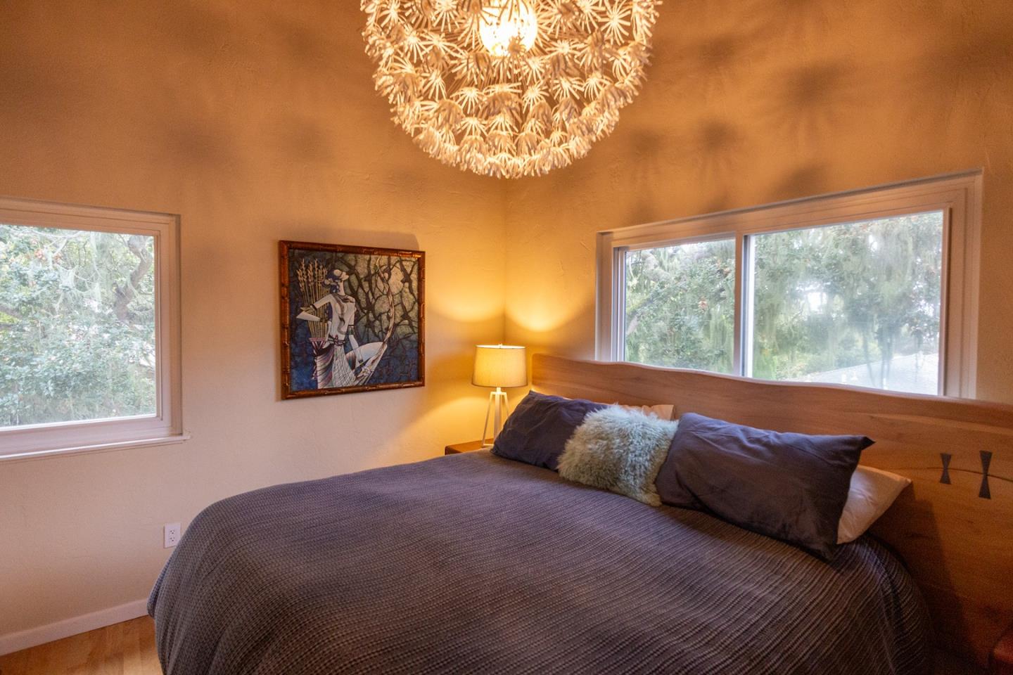 779 Alice Street Monterey, CA 93940 - Photo 12 of 27 a bedroom with a bed and a large window