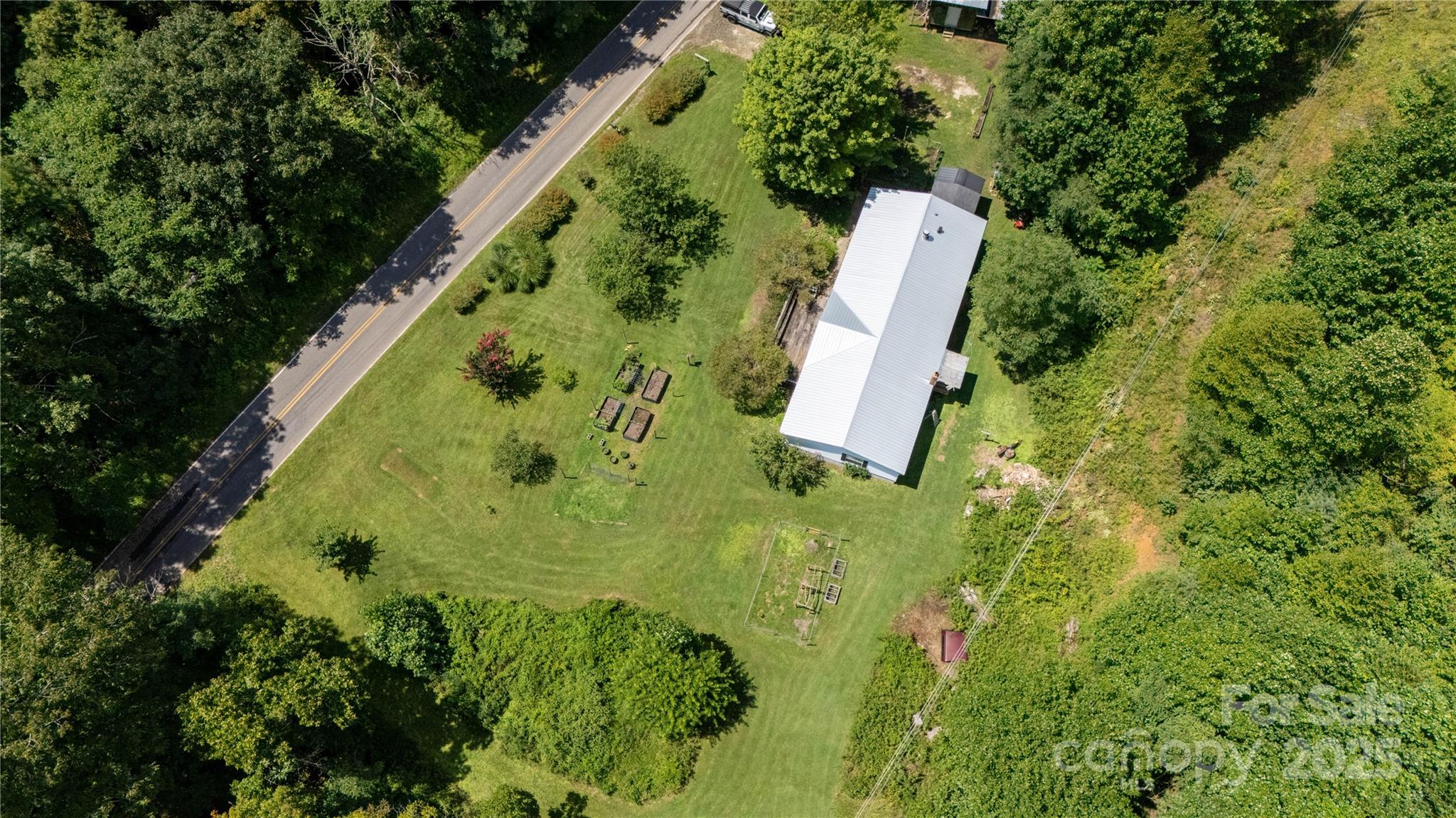 614 Upper Doe Bag Road Green Mountain, NC 28740 - Photo 12 of 44 an aerial view of a garden