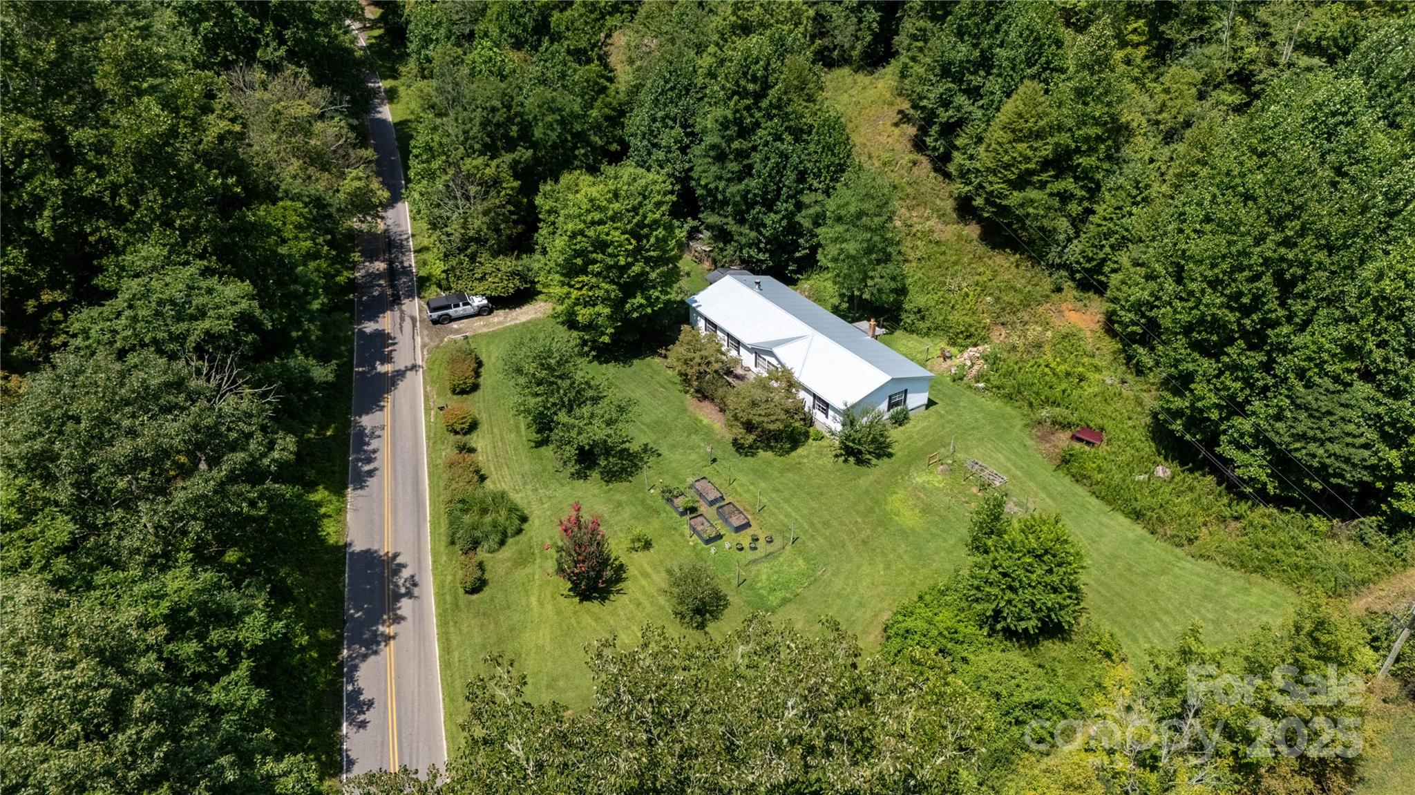 614 Upper Doe Bag Road Green Mountain, NC 28740 - Photo 15 of 44 an aerial view of residential house with outdoor space