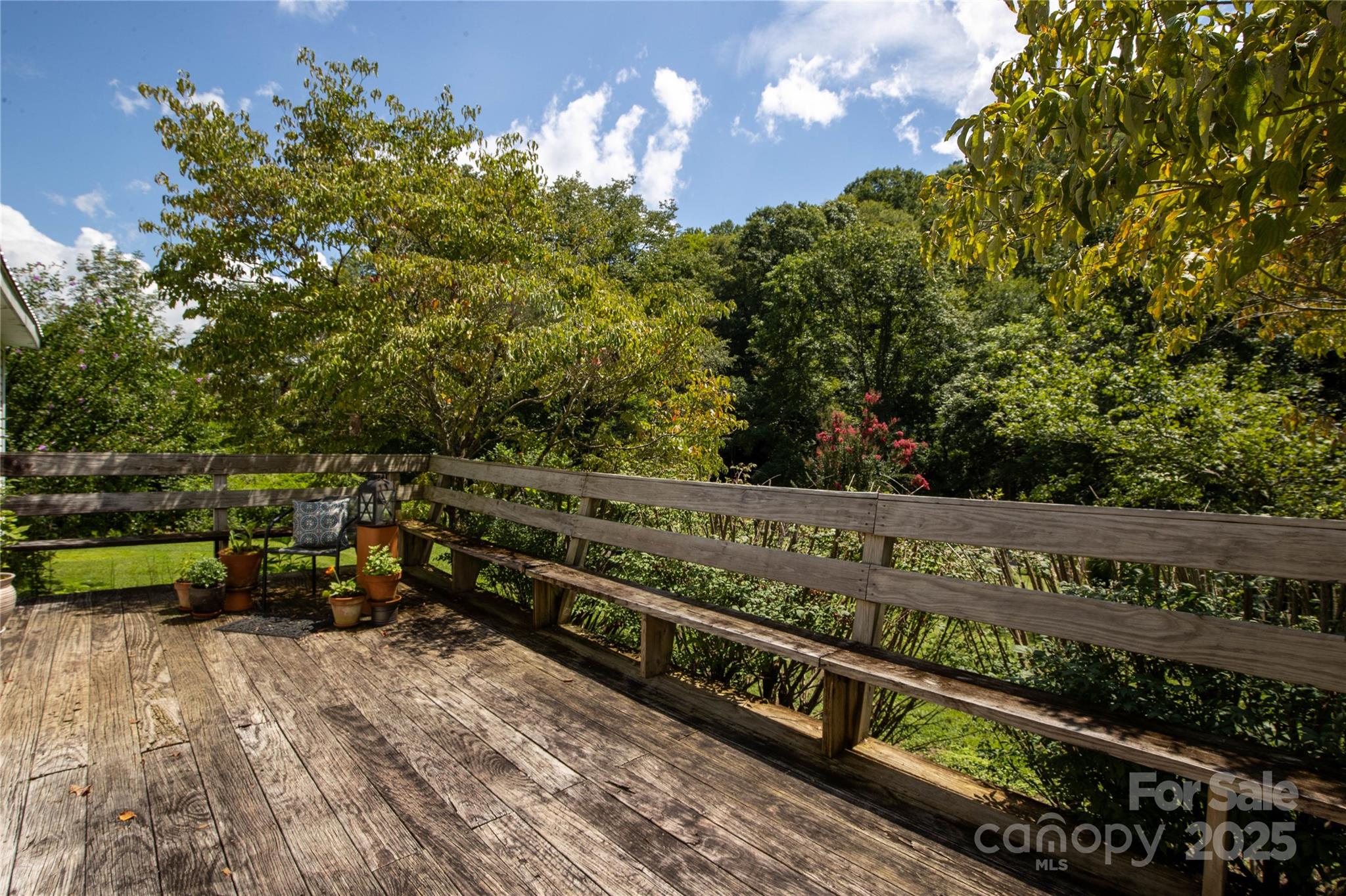 614 Upper Doe Bag Road Green Mountain, NC 28740 - Photo 23 of 44 a view of a bench with wooden fence