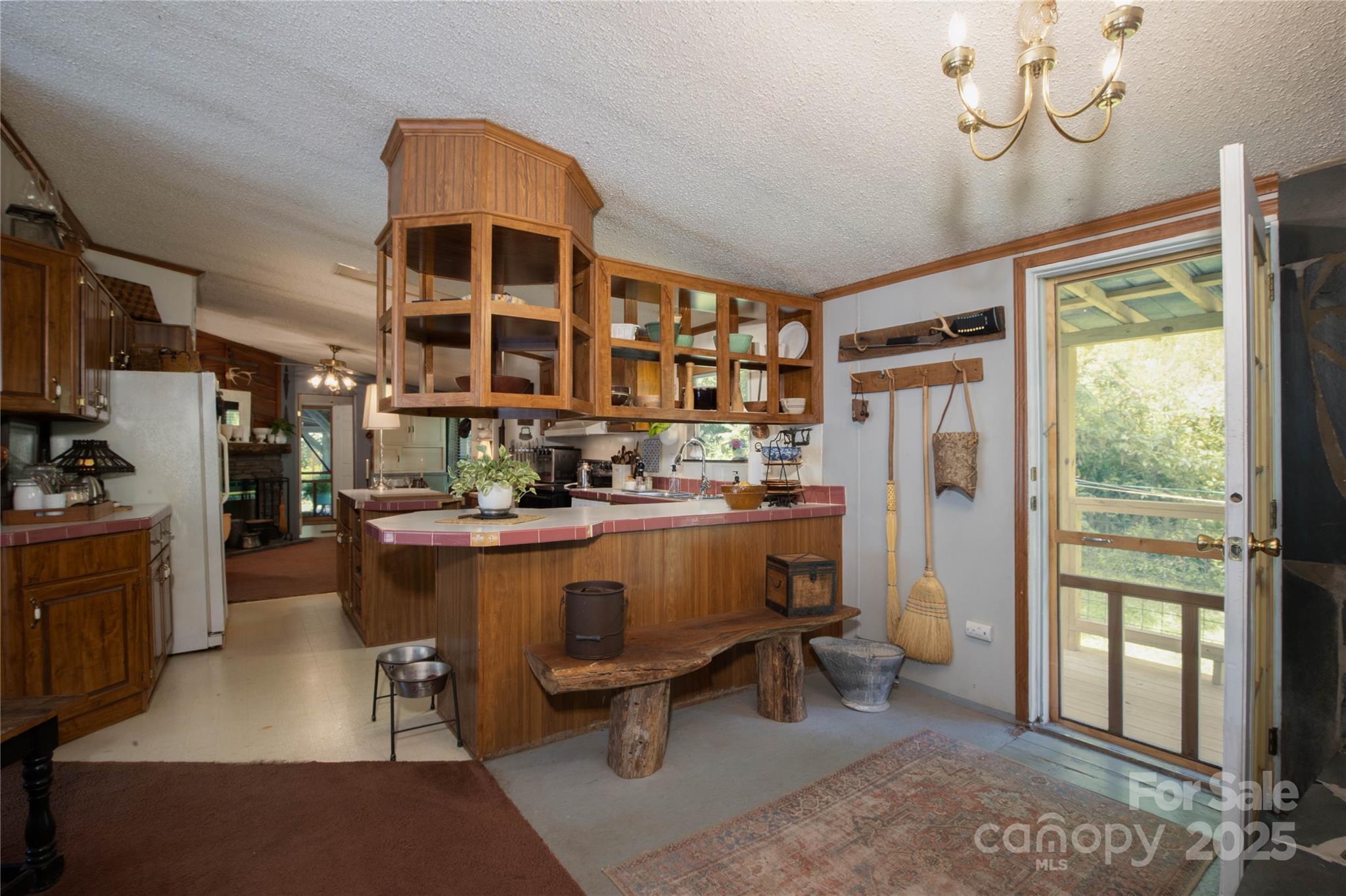 614 Upper Doe Bag Road Green Mountain, NC 28740 - Photo 28 of 44 a kitchen with a sink and a refrigerator