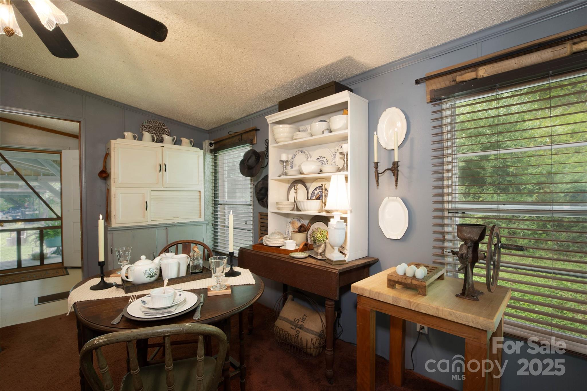 614 Upper Doe Bag Road Green Mountain, NC 28740 - Photo 32 of 44 a living room with furniture and a large window