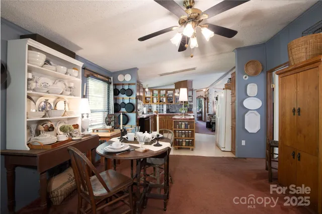a view of entryway with furniture and wooden floor