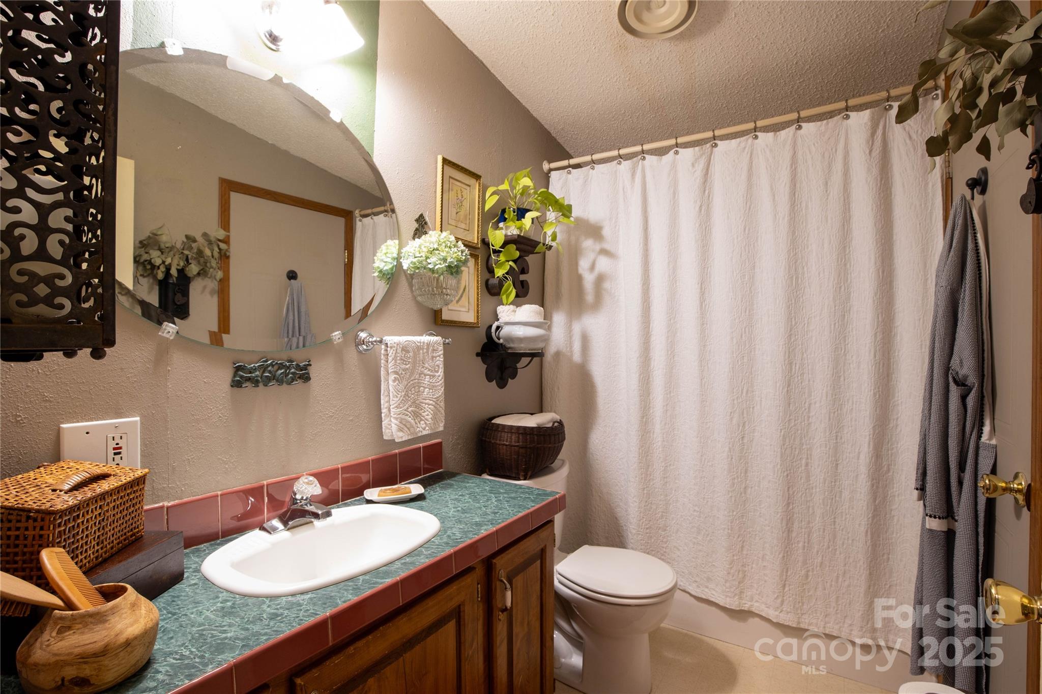 614 Upper Doe Bag Road Green Mountain, NC 28740 - Photo 42 of 44 a bathroom with a granite countertop sink and a mirror