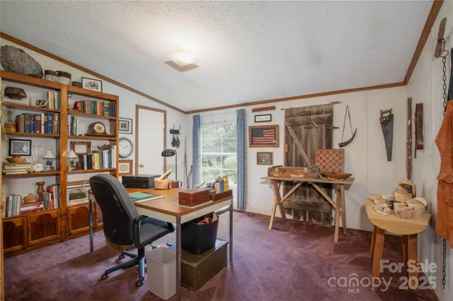 a work room with furniture and wooden floor