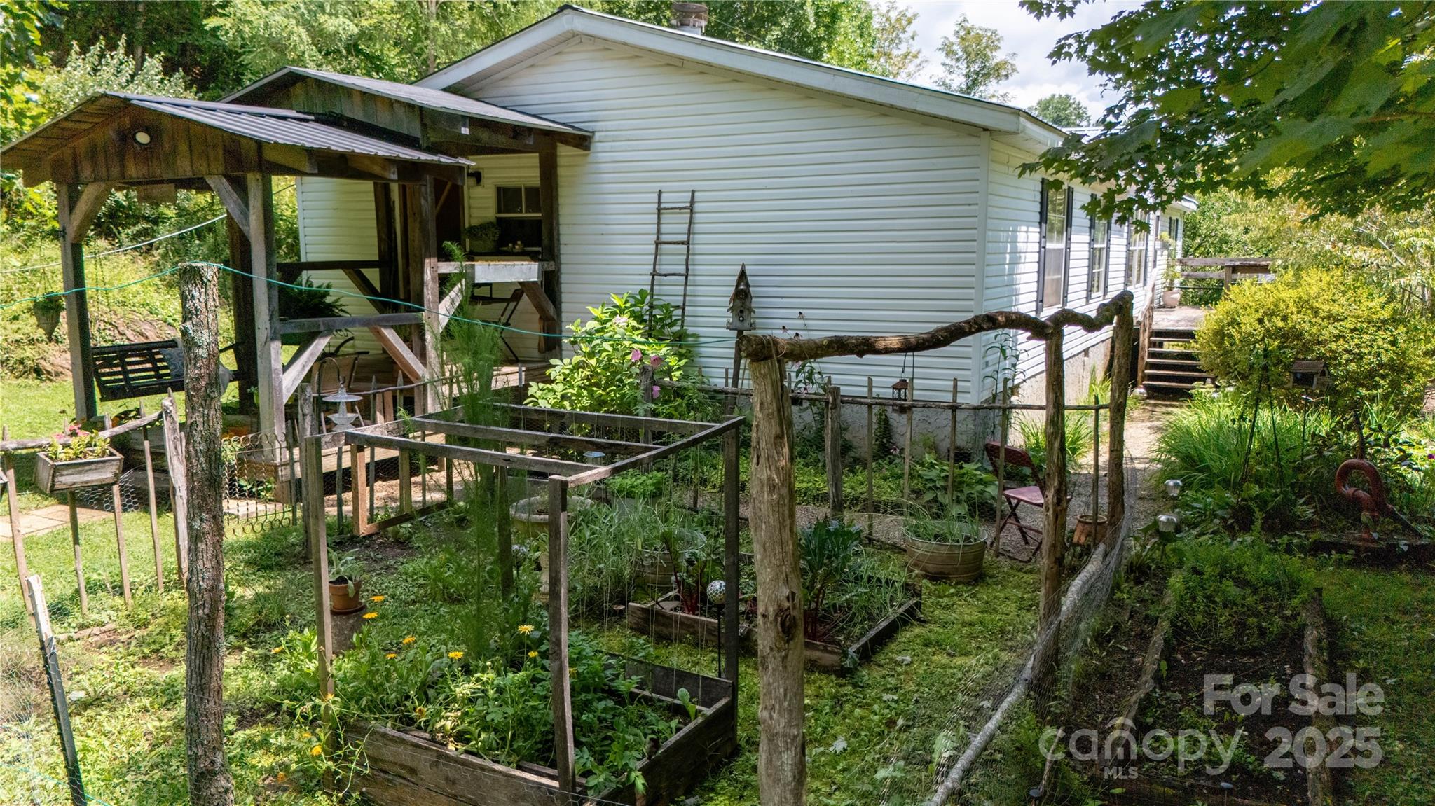614 Upper Doe Bag Road Green Mountain, NC 28740 - Photo 5 of 44 a backyard of a house with seating space