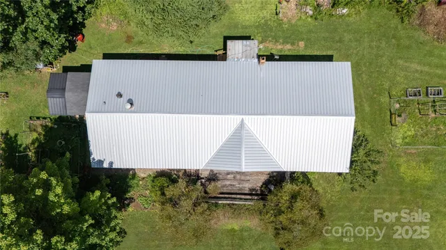 an aerial view of residential house with outdoor space