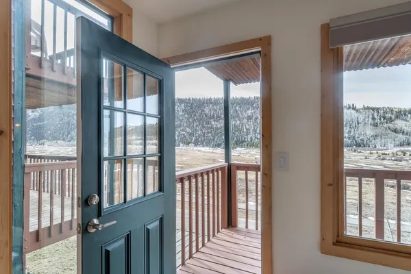 a view of a glass door and the balcony