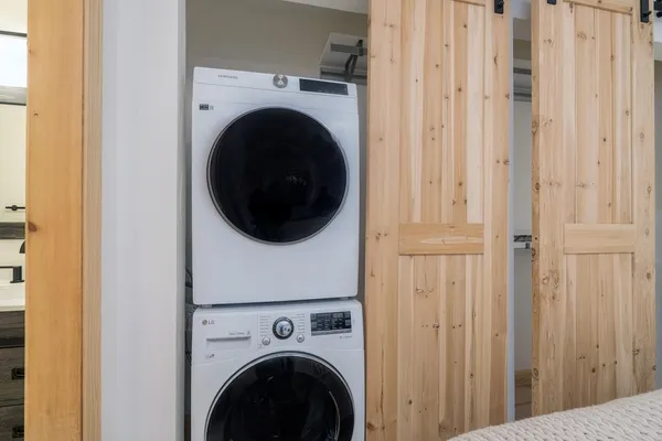 a view of a hallway with washer and dryer