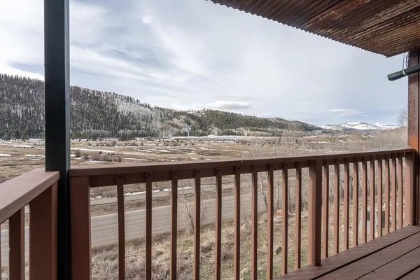 a view of city and mountain from a balcony