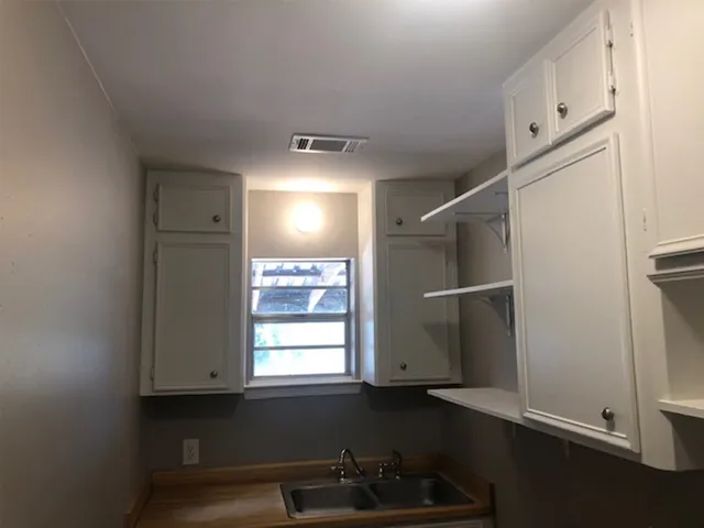 a kitchen with stainless steel appliances a refrigerator and a sink
