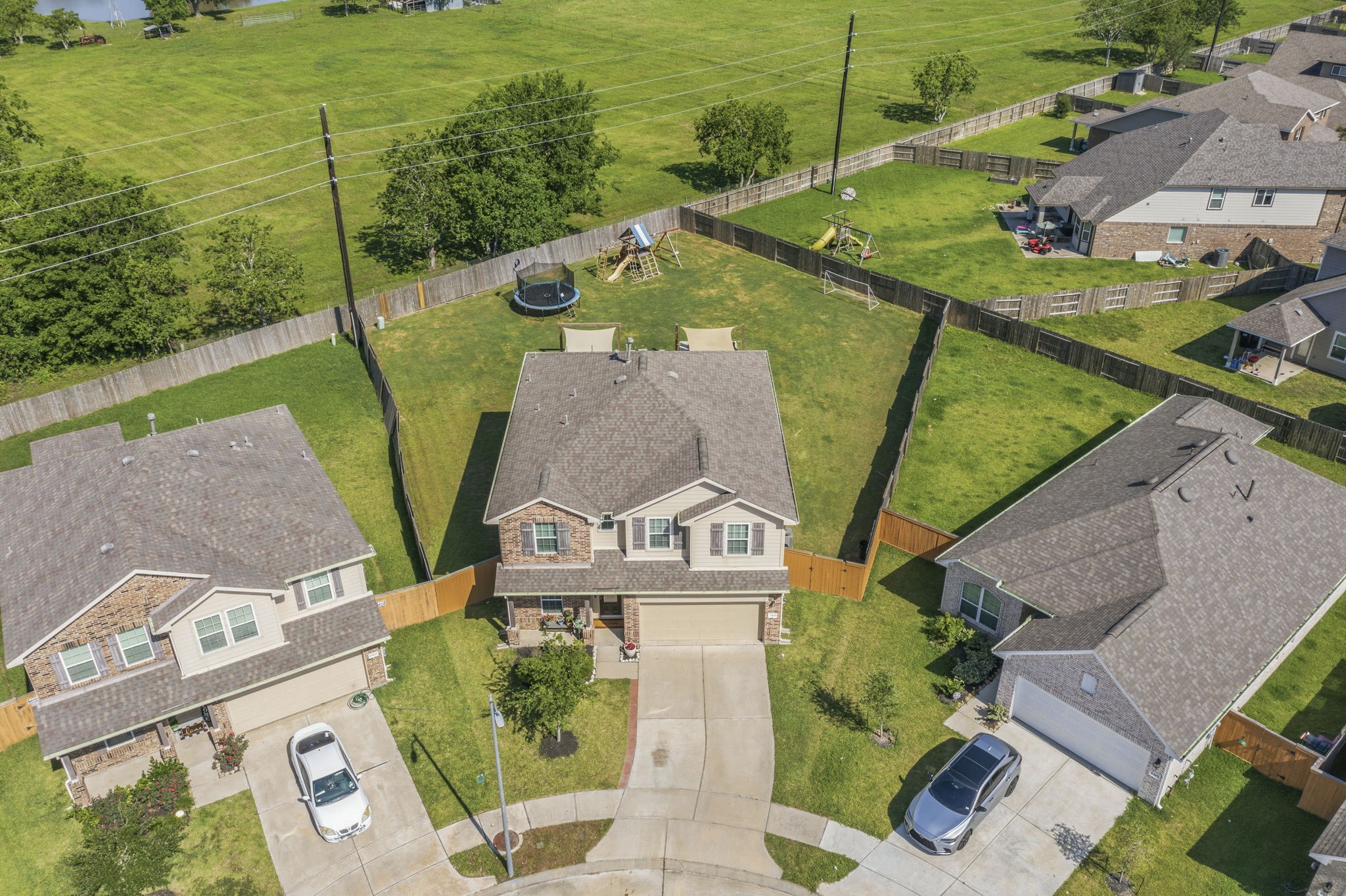 2401 Abbot Brk Drive Rosharon, TX 77583 - Photo 3 of 50 Before we head inside, we'd like to give you a sneak peek at this incredible lot with tons of room to play! Nothing but green space behind you!
