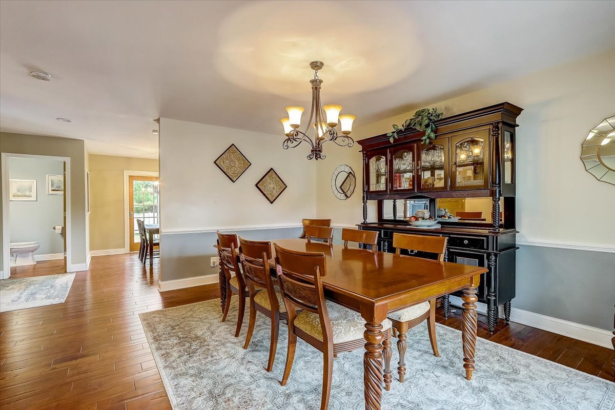 4365 Phyllis Drive Northbrook, IL 60062 - Photo 11 of 55 a view of a dining room with furniture and wooden floor