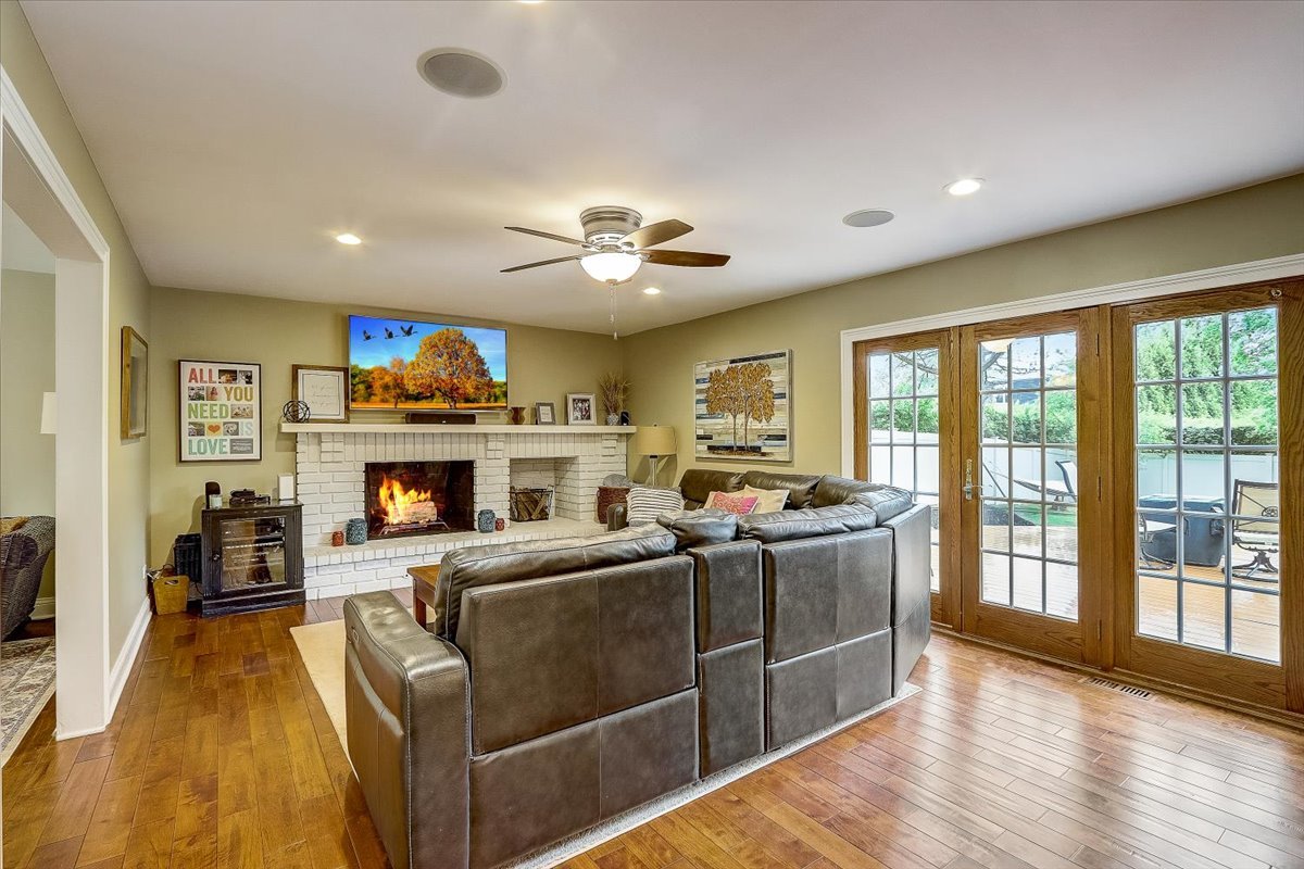 4365 Phyllis Drive Northbrook, IL 60062 - Photo 13 of 55 a living room with furniture a fireplace and a flat screen tv