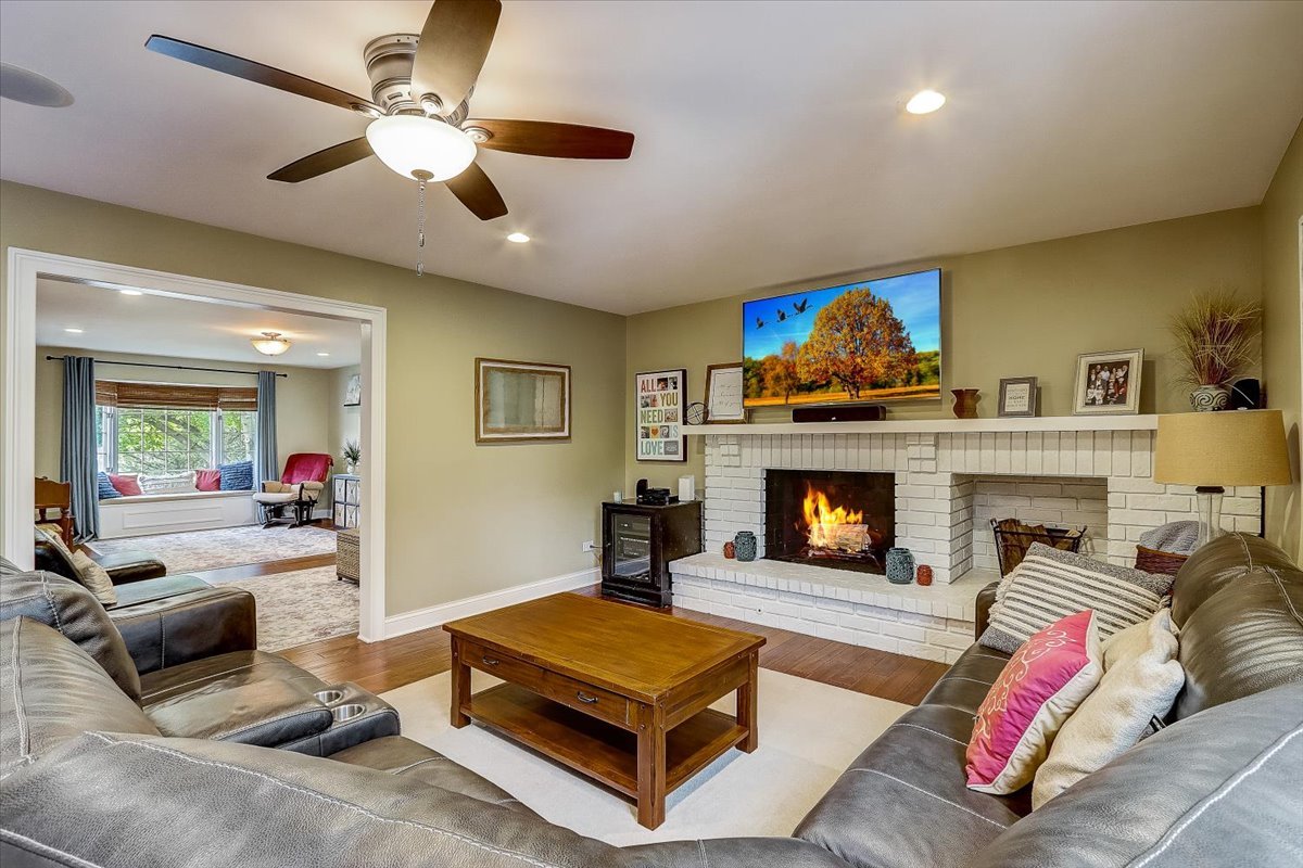 4365 Phyllis Drive Northbrook, IL 60062 - Photo 14 of 55 a living room with furniture and a fireplace