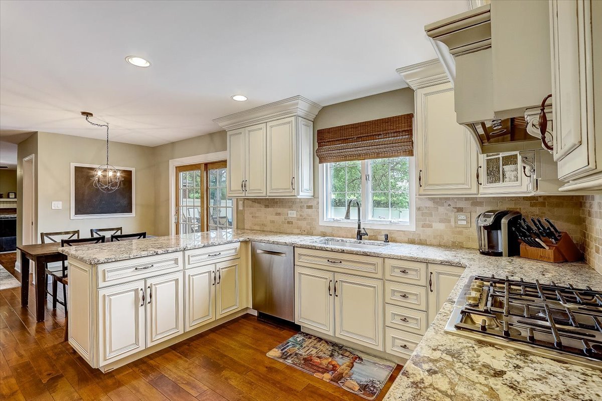 4365 Phyllis Drive Northbrook, IL 60062 - Photo 20 of 55 a kitchen with a stove a sink and a microwave