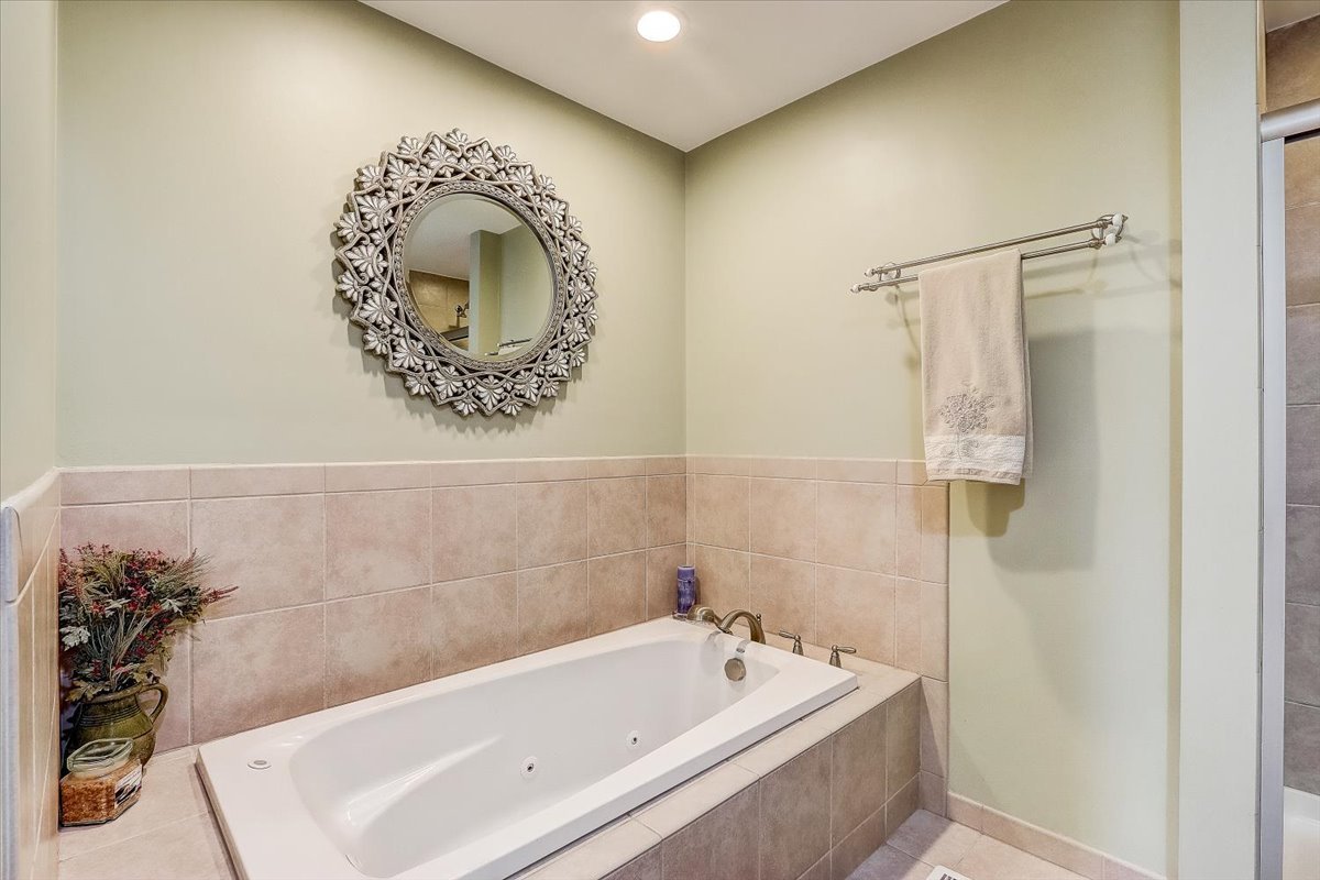 4365 Phyllis Drive Northbrook, IL 60062 - Photo 32 of 55 a bathroom with a tub and a shower