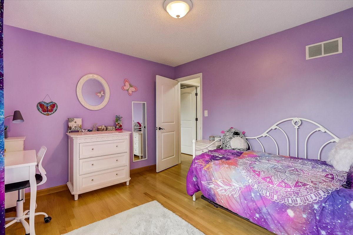 4365 Phyllis Drive Northbrook, IL 60062 - Photo 36 of 55 a bedroom with a bed and a dresser