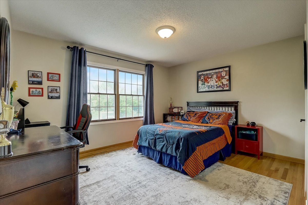 4365 Phyllis Drive Northbrook, IL 60062 - Photo 37 of 55 a bedroom with a bed and a dresser next to a window