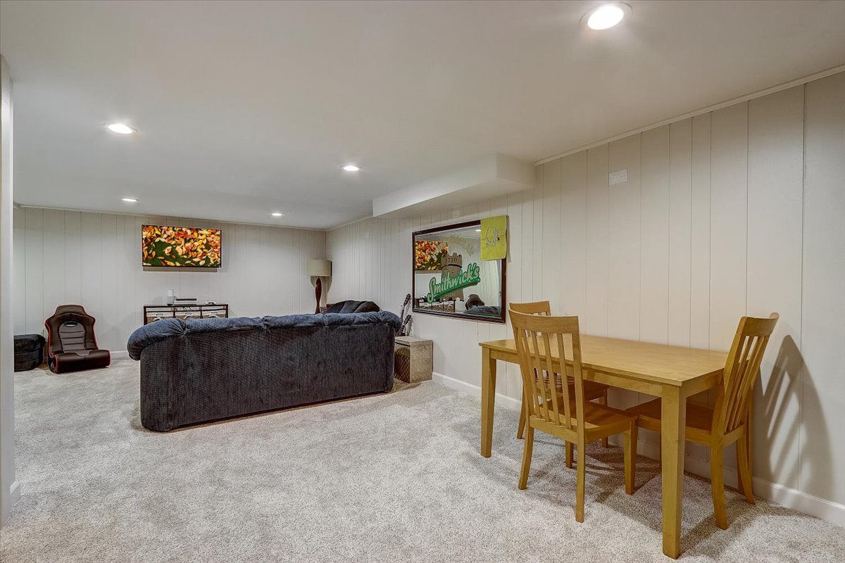 4365 Phyllis Drive Northbrook, IL 60062 - Photo 42 of 55 a living room with furniture and a flat screen tv