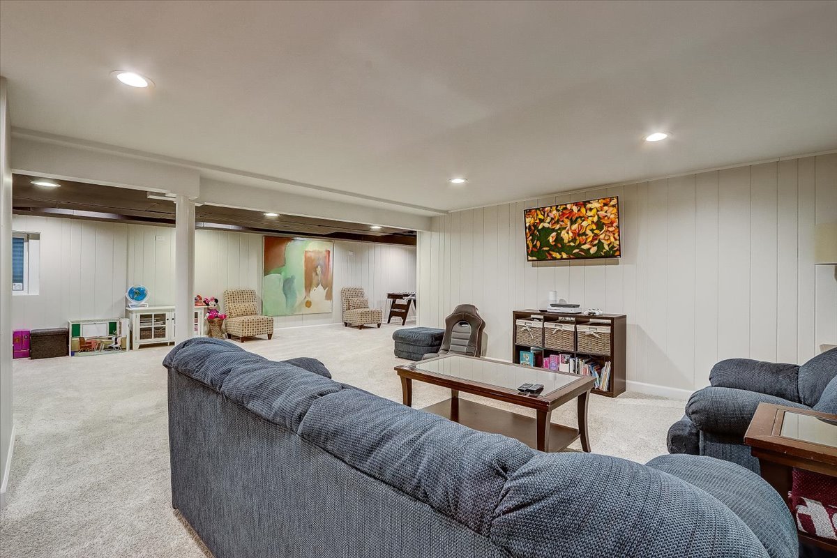 4365 Phyllis Drive Northbrook, IL 60062 - Photo 44 of 55 a living room with furniture and a flat screen tv