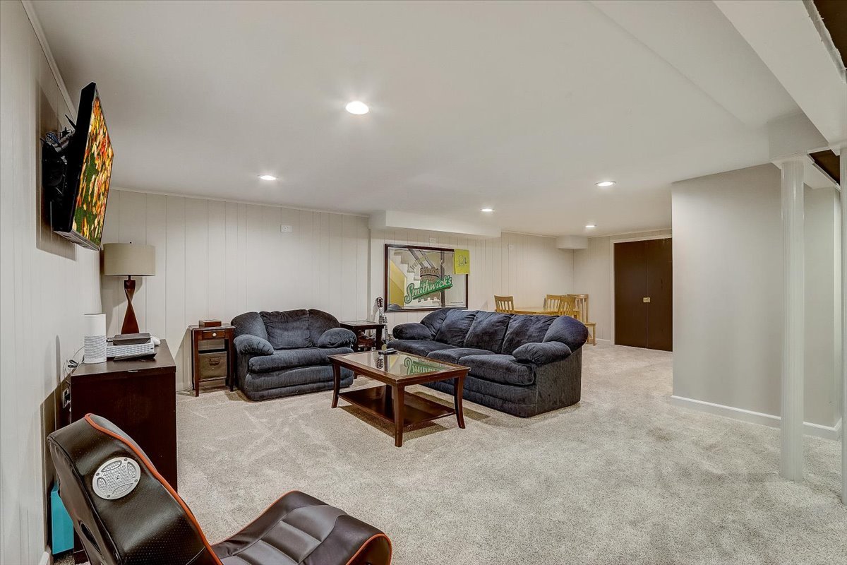 4365 Phyllis Drive Northbrook, IL 60062 - Photo 48 of 55 a living room with furniture and a flat screen tv