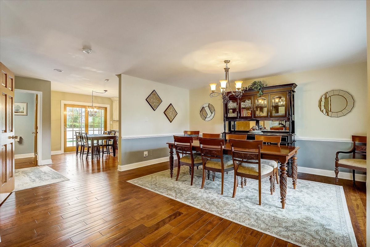 4365 Phyllis Drive Northbrook, IL 60062 - Photo 10 of 55 a view of a dining room with furniture and wooden floor