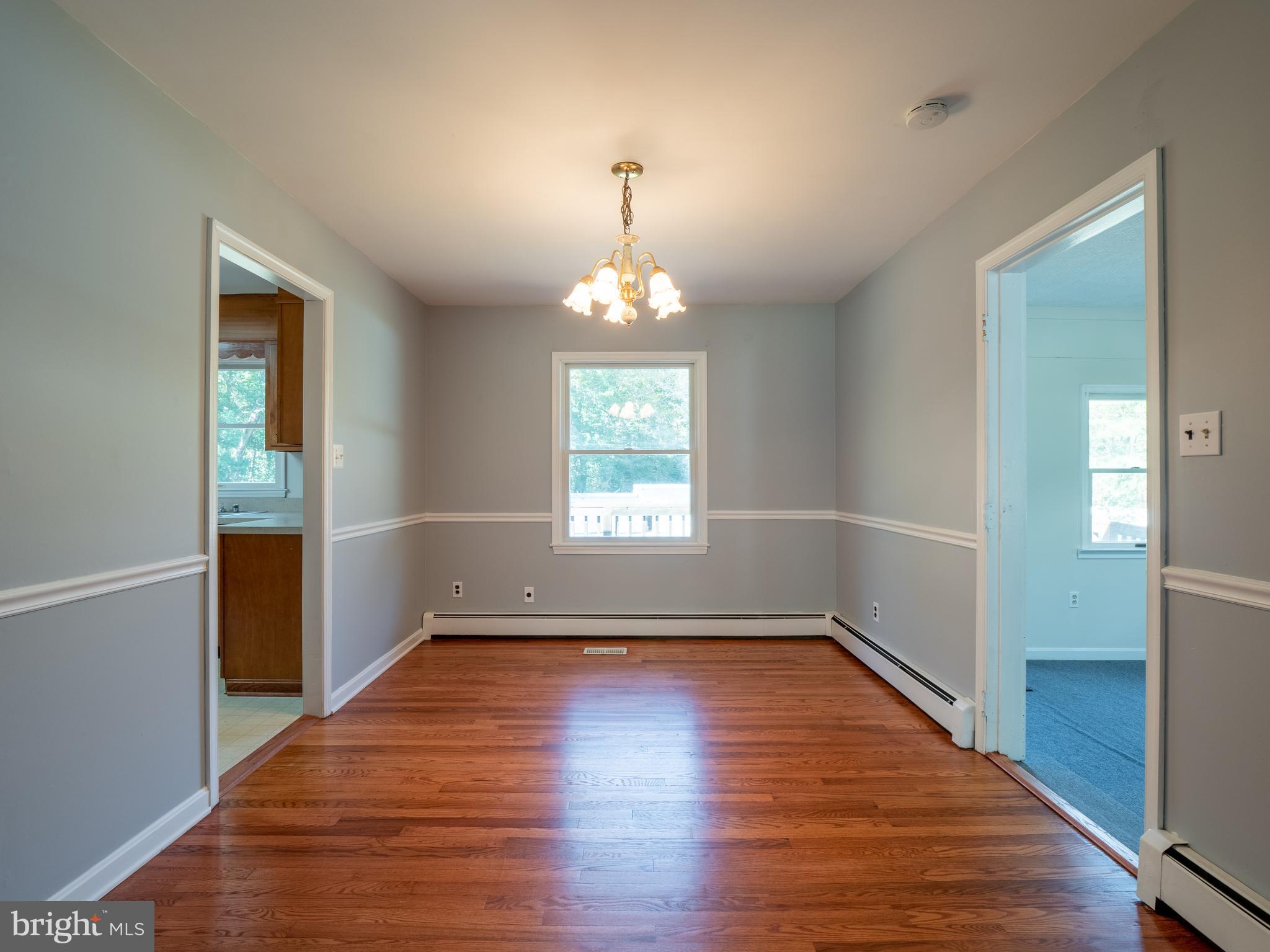 580 Plum Point Road Huntingtown, MD 20639 - Photo 13 of 48 Separate Dining Room with chair rail