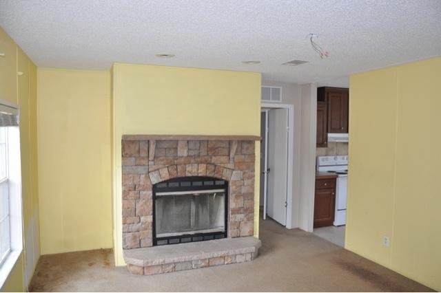 658 Coventry Road DeFuniak Springs, FL 32433 - Photo 7 of 14 Living room and fireplace