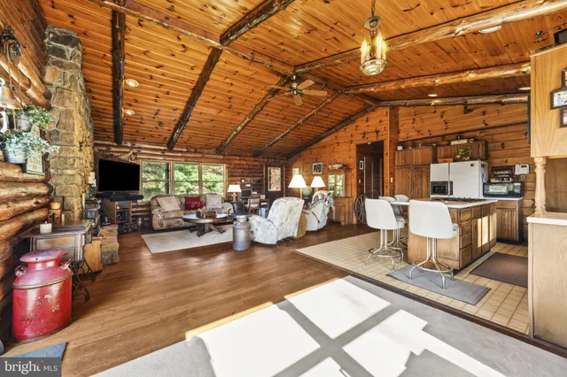 a view of a patio with table and chairs