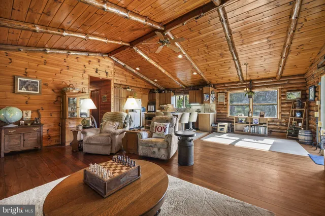 a living room with lots of furniture and gym equipment