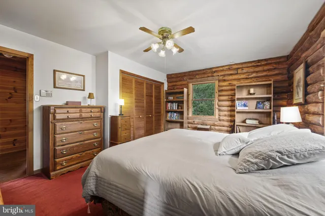 a bedroom with a large bed and a large window