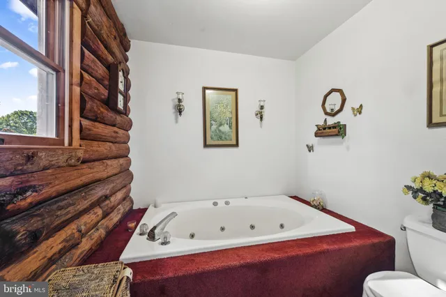 a bathroom with a bathtub and shower
