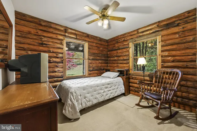 a bedroom with a bed and a table