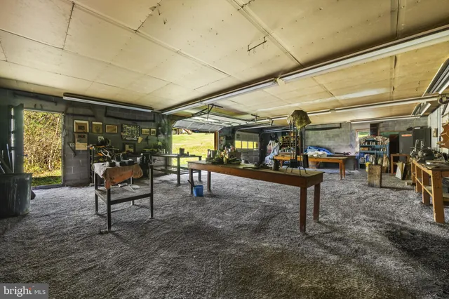 a living room with lots of furniture and a window