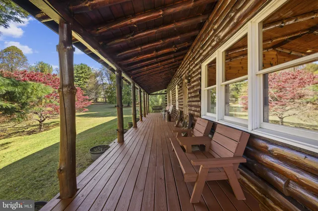 a view of a two chairs in the balcony