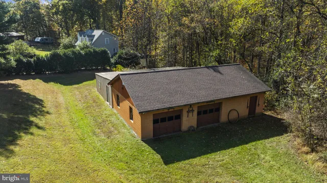 a backyard of a house with yard and outdoor seating