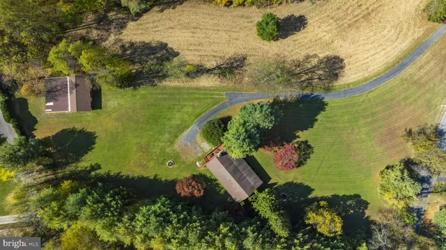 a view of a lake with a yard and mountain view