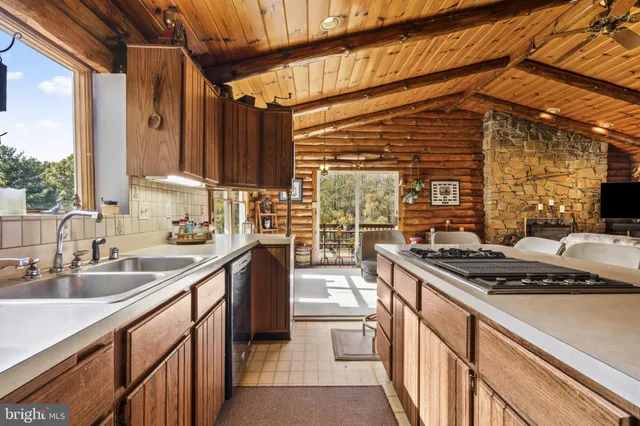 a kitchen that has a sink and a stove