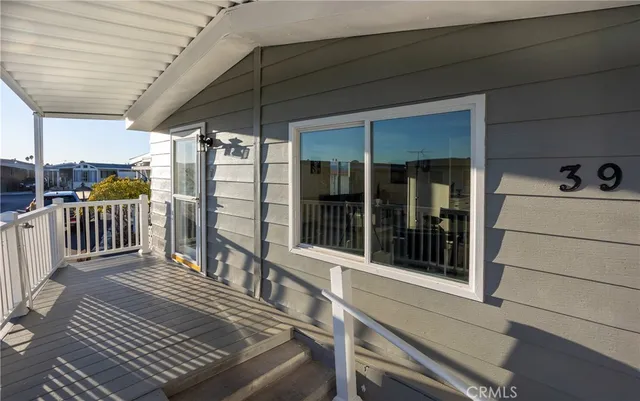a view of a balcony with dining area