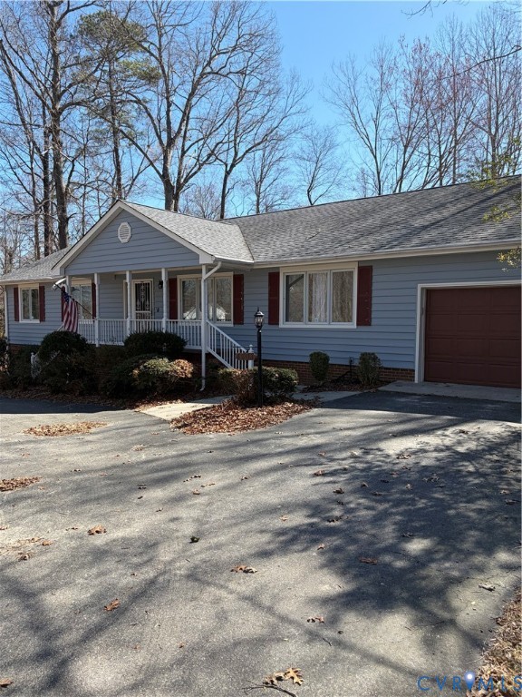 4603 Edenton Place Chester, VA 23831 - Photo 2 of 8 a front view of a house with a yard