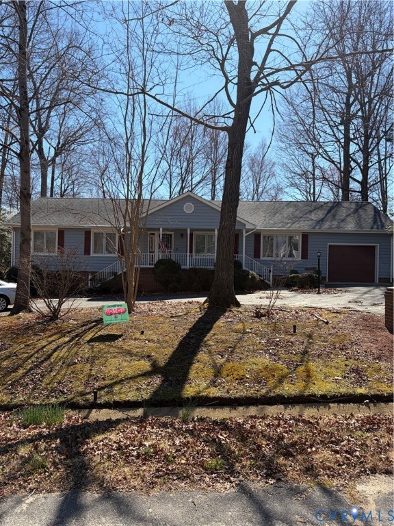4603 Edenton Place Chester, VA 23831 - Photo 3 of 8 a view of a white house with a large tree next to a yard with large tree