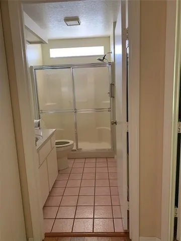 a bathroom with a shower and a toilet